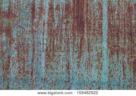 Rusted blue painted metal wall. Texture. Metal