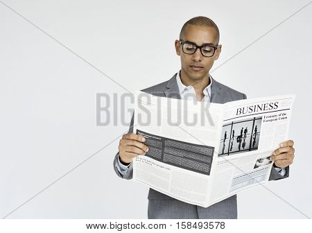 Businessman Reading Newspaper Article Journal Concept