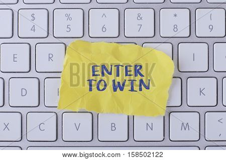 Enter to win./ Enter to win card with information on the keyboard