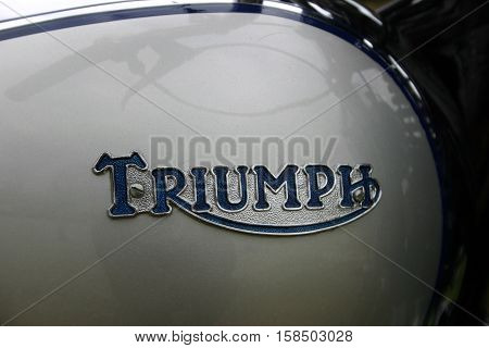 Triumph Tiger 1939 500cc Motorcycle. Photographed at Coleford Carnival of Transport, England. 12th April 2009. (close up tank and Triumph Emblem