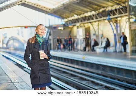 Beautiful Young Woman Waiting For A Train In Parisian Underground