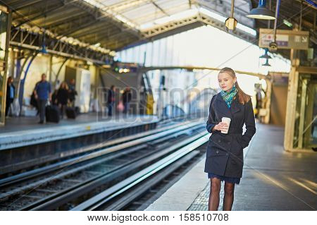 Beautiful Young Woman Waiting For A Train In Parisian Underground