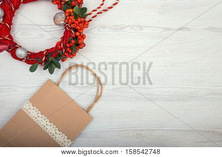 Christmas background on wooden table and copy space shopping bag