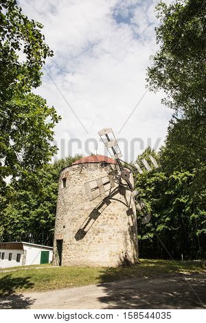 Old tower windmill in Holic Slovak republic. Architectural theme. Cultural heritage. Beautiful symbolic object. Travel destination. Vertical composition.