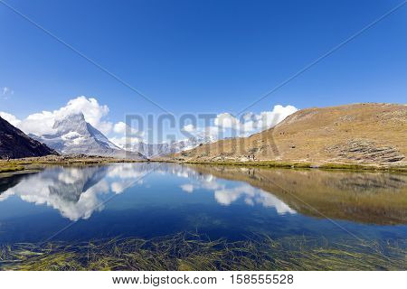 Riffelsee is an alpine lake above the town of Zermatt in the canton of Valais, Switzerland. It lies below the Riffelhorn at an elevation of 2757 m, and has a surface area of 0.45 ha. The lake can be reached from Rotenboden railway station (2815 m) on the 