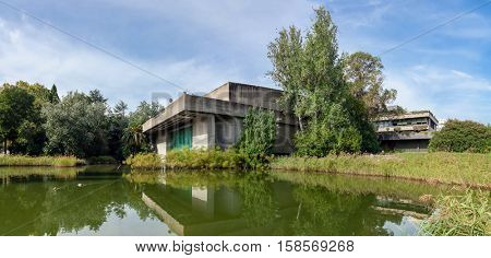 Lisbon, Portugal - October 19, 2016: The auditorium seen across the lake in the garden of the Calouste Gulbenkian foundation. A very popular urban park open to the public.