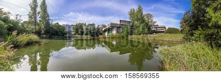 Lisbon, Portugal - October 19, 2016: The auditorium seen across the lake in the garden of the Calouste Gulbenkian foundation. A very popular urban park open to the public.