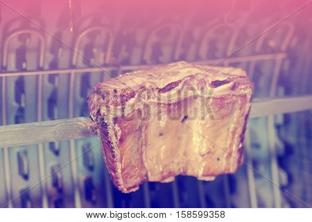 Pork ribs cut on old style electric grill, toned image