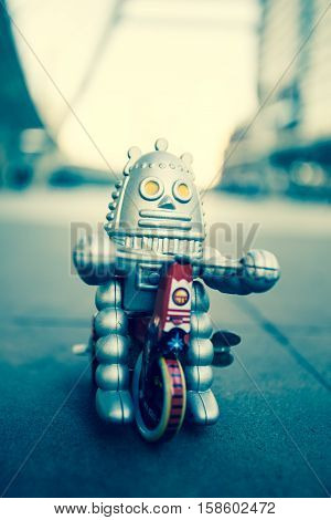 Old robot toy, vintage color style, vintage tone background.