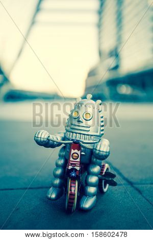 Old robot toy, vintage color style, vintage tone background.