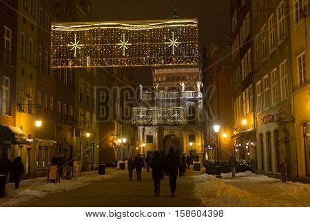 POLAND GDANSK - DECEMBER 30 2014: Nigh town on Long Market (Dlugi Targ) street before Christmas. Gdansk is a Polish city on the Baltic coast and popular center of tourism.