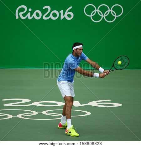 RIO DE JANEIRO, BRAZIL - AUGUST 11, 2016: Grand Slam champion Juan Martin Del Potro of Argentina in action during his quarterfinal match of the Rio 2016 Olympic Games at the Olympic Tennis Centre