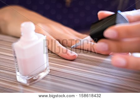 nail paint manicure in the finger closeup