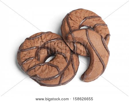 Heap of chocolate cookies in different shape isolated on white background