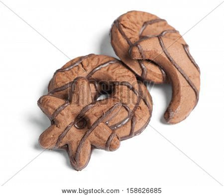 Heap of chocolate cookies in different shape isolated on white background