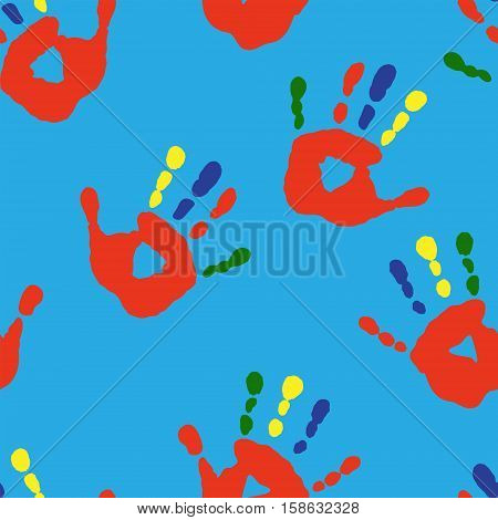 Seamless texture with a handprints on a blue background