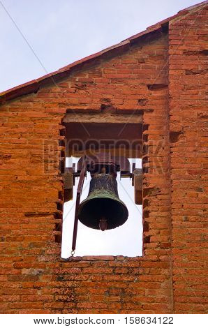 brick tower with bells ringing to tell the time