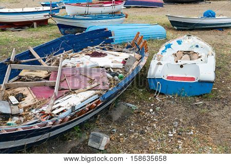 Old Wrecks of fishing sloop on Sicilian beach