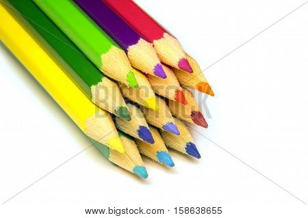 a stack of colored pencils on a white background isolated