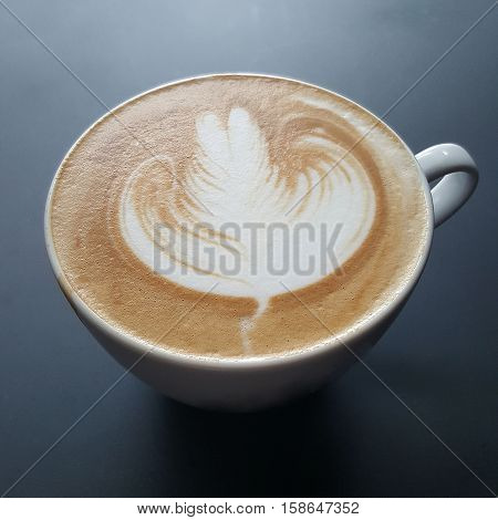 Close up Coffee latte art on black background.