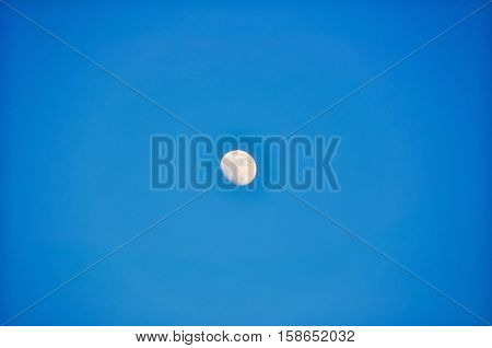 Moon during a nice blue sky day