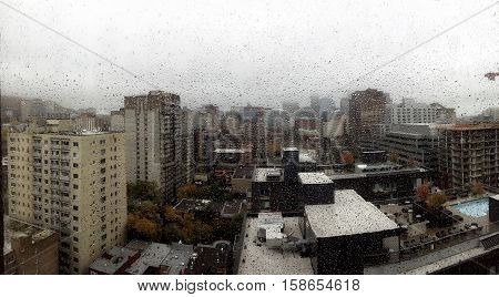 Montreal downtown on a rainy day with raindrop on a window
