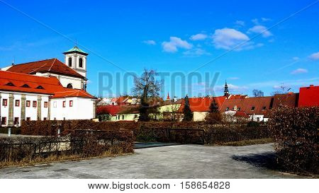 Monastic garden in nice sunny day with clear blue sky with a few clouds.