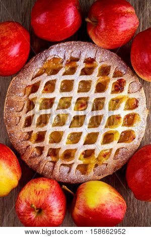 Home baked Lattice apple pie on wooden table.