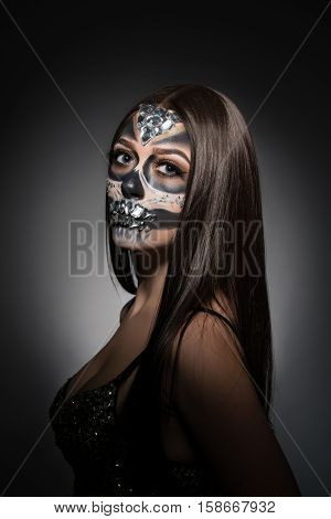 Santa Muerte. Image of pretty young woman with face art