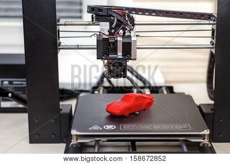 3d printer and printed models machine red