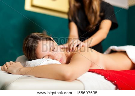 Woman having a massage in a spa