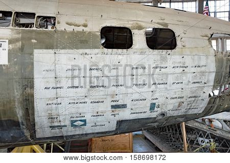 DAYTON, OHIO, USA-NOVEMBER 18, 2016:National Museum USAF is restoring WWII The Swoose Flying Fortress bomber the oldest B-17 & only D model in existence. Shown here with countries visited on fuselage.