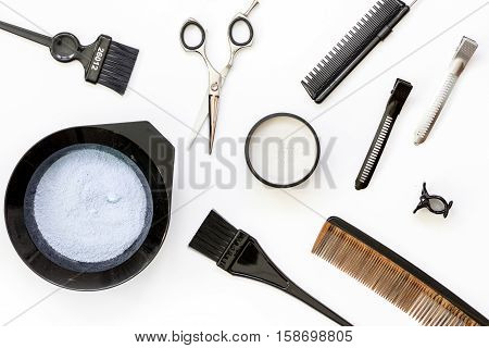 Tools for hair dye and hairdye top view on white background