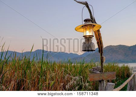the lamp on the wood bridge go to the lake and mountain