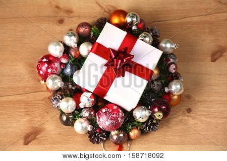 New Year gift on a golden tinsel background boly.
