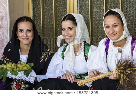 QUARTU S.E., ITALY - September 17, 2016: Parade of Sardinian costumes and floats for the grape festival in honor of the celebration of St. Helena. - Sardinia - portrait of beautiful girls in traditional Sardinian costume