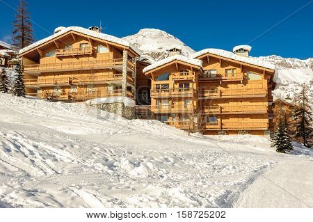Alpine winter mountain landscape. French Alps covered with snow in sunny day. Val-d'Isere, France