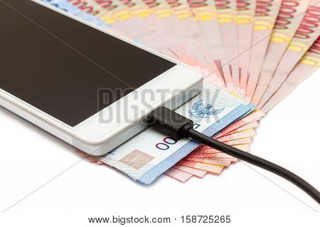 Smartphone And Money Of Indonesian Rupiah