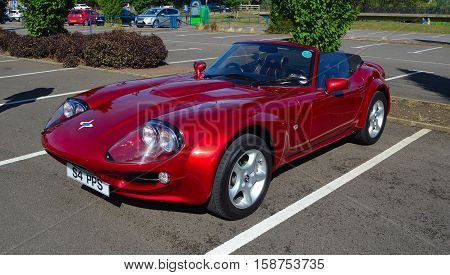 ST NEOTS, CAMBRIDGESHIRE, ENGLAND - SEPTEMBER 11, 2016: Classic Red 1999 Marcos Mantara Sports car.