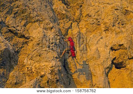 Rock climber on a steep rock. Cape Alchak Crimea.