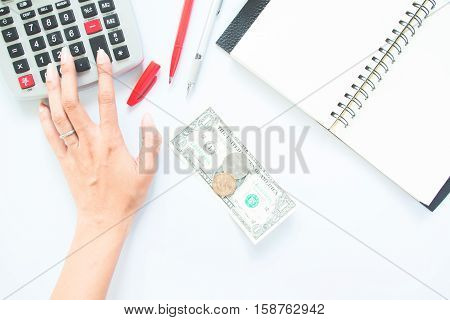 Accounting concept with hand pressing on calculater