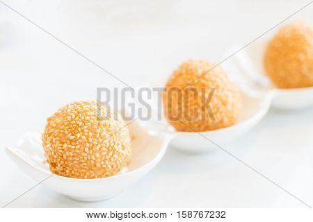 Chinese dim sum Fried sesame balls stuff with custard lava - Chinese groumet cuisine