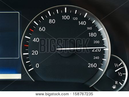 Driving very fast, speedometer showing 210