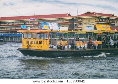 Bangkok, Thailand - January 8, 2016: The ferry is sailing to the Wat Rakhang Pier on Chao Phraya River, Bangkok, Thailand. Here is the famous Wat Rakhang Girls' School.