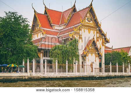 Wat Rakangkositaram Woramahavihan is Buddhist Temple which located on the banks of the Chao Phraya River in the tourist center of Bangkok.