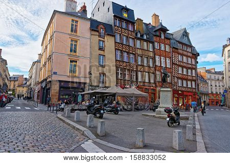 Rennes, France - May 7, 2012: Old houses at Champ Jacquet square in the city center of Rennes Brittany region France. People on the background.