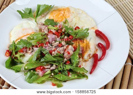 Thai Food,spicy Wing Bean With Pork Topped Fried Egg.