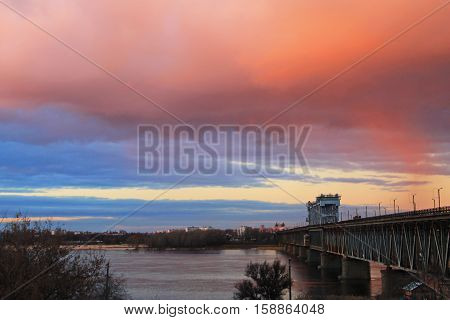 Bridge across river Dnieper at sunset in Kremenchug, Ukraine