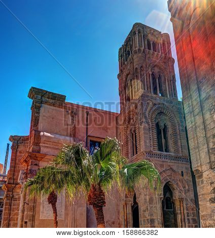 Belltower of church Martorana with palm trees, Palermo. Sicily. Beautiful architecture of the historical district.