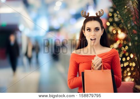 Funny Woman with Christmas Reindeer Horns Headband Shopping
